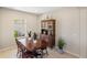 Dining room with a dark wood table and chairs and china cabinet at 12116 Stuart Dr, Venice, FL 34293