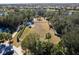 Aerial view of community dog park, with fencing and mature landscaping at 12116 Stuart Dr, Venice, FL 34293