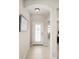 Inviting foyer with tile flooring, a decorative front door and a 'Welcome Home' sign at 12116 Stuart Dr, Venice, FL 34293
