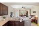 Open kitchen with stainless steel appliances overlooking the living room at 12116 Stuart Dr, Venice, FL 34293