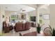 Open concept living room with a ceiling fan, tile floors, and neutral paint at 12116 Stuart Dr, Venice, FL 34293