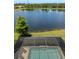 Beautiful waterfront view from screened-in lanai, offering tranquility and stunning scenery of a big pond at 12116 Stuart Dr, Venice, FL 34293