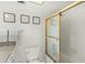 Bright bathroom features a shower/tub combo, granite countertops, and decorative artwork at 1255 Tarpon Center Dr # 309, Venice, FL 34285