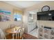 View of the Dining Area has views to the kitchen and light-colored wood floors at 1255 Tarpon Center Dr # 309, Venice, FL 34285