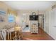 Dining Area adjacent to the kitchen has wood floors and views of the water at 1255 Tarpon Center Dr # 309, Venice, FL 34285