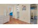 Hallway view with a side table, access to the living room, bathroom, and bedroom with a closet at 1255 Tarpon Center Dr # 309, Venice, FL 34285