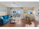 Inviting living room with water view, ceiling fan, and dining area at 1255 Tarpon Center Dr # 309, Venice, FL 34285