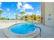 Enjoy the community pool featuring blue waters, well-manicured palm trees, and access to the beach at 1255 Tarpon Center Dr # 309, Venice, FL 34285