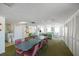 Spacious recreation room with a long table, a kitchenette, lounge furniture, and natural light at 1255 Tarpon Center Dr # 309, Venice, FL 34285