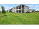 Exterior view of screened in lanai overlooking expansive backyard of a townhome at 12680 Radiance Ct # 12-101, Venice, FL 34293
