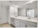 Bathroom with double sink vanity, large mirror, and tiled floors at 12680 Radiance Ct # 12-101, Venice, FL 34293