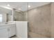 Bathroom featuring tiled shower, vanity, and tiled floors at 12680 Radiance Ct # 12-101, Venice, FL 34293
