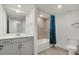 Bathroom features white cabinets, tile shower, and a full sized tub with designer shower curtain at 12680 Radiance Ct # 12-101, Venice, FL 34293