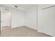 Well lit room offers decorative floor tiling and neutral paint; includes a closet and doorway at 12680 Radiance Ct # 12-102, Venice, FL 34293