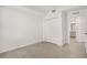 The well lit room offers decorative floor tiling and neutral paint; includes a door for storage access at 12680 Radiance Ct # 12-101, Venice, FL 34293