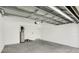 Spacious attached garage with modern door mechanics and clean, painted walls at 12680 Radiance Ct # 12-101, Venice, FL 34293