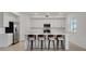 Modern kitchen with white cabinetry, stainless steel appliances, and quartz countertops at 12680 Radiance Ct # 12-101, Venice, FL 34293