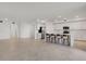 Open concept kitchen with island seating, stainless steel appliances, and ample space at 12680 Radiance Ct # 12-102, Venice, FL 34293