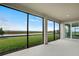 Covered patio with serene views of a lake and lush greenery at 12680 Radiance Ct # 12-102, Venice, FL 34293