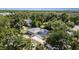 An aerial view of a home nestled amongst lush greenery and mature trees at 1345 24Th St, Sarasota, FL 34234