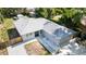 Aerial view of a home with a new roof, gravel landscaping, and an updated driveway at 1345 24Th St, Sarasota, FL 34234