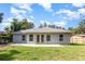 A spacious backyard featuring a patio and well-maintained lawn at 1345 24Th St, Sarasota, FL 34234