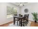 Cozy dining room features a wood table, four chairs, and a large window with natural light at 1345 24Th St, Sarasota, FL 34234