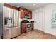 Kitchen featuring stainless steel appliances, dark cabinets, and a door to the exterior at 1345 24Th St, Sarasota, FL 34234
