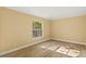 Comfortable bedroom featuring wood floors, natural lighting, and neutral wall color at 1399 Shields St, Punta Gorda, FL 33980