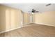 Spacious bedroom with a ceiling fan, wood floors, and ample natural light from the window at 1399 Shields St, Punta Gorda, FL 33980