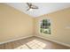 Bright bedroom featuring wood floors, a ceiling fan, and a large window at 1399 Shields St, Punta Gorda, FL 33980