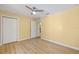 Bedroom features blonde floors, yellow walls, and a standard closet with double doors at 1399 Shields St, Punta Gorda, FL 33980