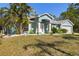 Charming single-story home featuring a well-kept lawn, two-car garage and attractive curb appeal at 1399 Shields St, Punta Gorda, FL 33980