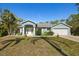 Charming single-story home with well-maintained landscaping, a two-car garage, and attractive curb appeal at 1399 Shields St, Punta Gorda, FL 33980