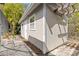The exterior of the shed features fresh paint, a window, a door and a stone walkway and mulch at 1399 Shields St, Punta Gorda, FL 33980