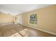 Sunny living room with wood floors, natural light, and an inviting atmosphere at 1399 Shields St, Punta Gorda, FL 33980