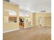 Bright living room featuring wood floors, an open layout, and seamless access to the adjacent kitchen at 1399 Shields St, Punta Gorda, FL 33980