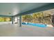 Screened pool featuring spa, tile border, and a concrete deck underneath a screened lanai at 1399 Shields St, Punta Gorda, FL 33980