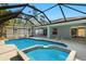 Enjoy the pool and integrated spa with screened enclosure, and access to the house at 1399 Shields St, Punta Gorda, FL 33980