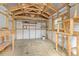 Unfinished shed features exposed framework and plywood flooring, offering a versatile storage space at 1399 Shields St, Punta Gorda, FL 33980