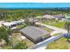 Aerial view showcasing the fenced backyard, and nearby waterfront at 1533 Olympia Rd, Venice, FL 34293