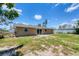 The backyard of this home features an open patio with glass door access to the home at 1533 Olympia Rd, Venice, FL 34293