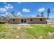 View of the backyard featuring a patio and sliding glass doors to the home at 1533 Olympia Rd, Venice, FL 34293