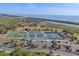 Aerial view of community basketball and tennis courts near the waterfront at 1533 Olympia Rd, Venice, FL 34293