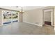 Dining room with tile floors and sliding glass doors to the backyard at 1533 Olympia Rd, Venice, FL 34293
