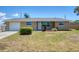 Charming single-story home featuring a well-maintained lawn and a one-car garage at 1533 Olympia Rd, Venice, FL 34293