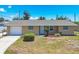 Charming single-story home featuring a well-maintained lawn and a one-car garage at 1533 Olympia Rd, Venice, FL 34293