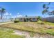 Charming single-story home featuring a well-maintained lawn and driveway at 1533 Olympia Rd, Venice, FL 34293