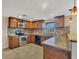 Kitchen with stainless steel appliances, granite countertops, and tile backsplash at 1533 Olympia Rd, Venice, FL 34293