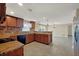 Open kitchen featuring granite counters, stainless steel appliances, and tile flooring at 1533 Olympia Rd, Venice, FL 34293